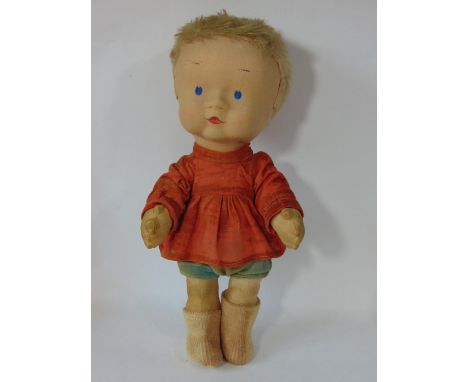 A rare fabric doll by Merrythought 1930's, with large felt covered head, short blonde hair and painted features. Cloth jointe