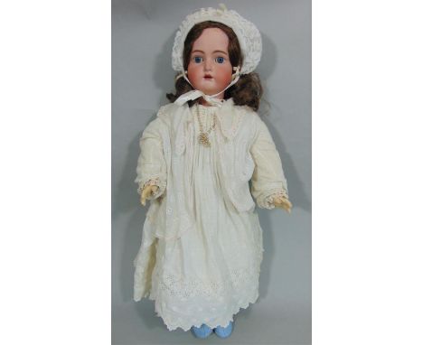 Bisque head doll by Kammer &amp; Rheinhardt with composition jointed body, fixed blue eyes, open mouth with teeth, pierced ea