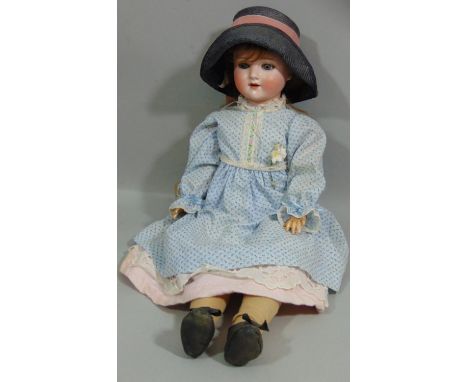 A Schoenau &amp; Hoffmeister bisque socket head doll, with weighted sleeping blue eyes and open mouth with four top teeth sho