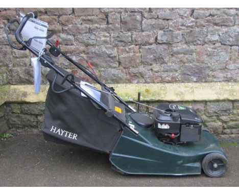A Hayter Harrier 48 petrol driven rotary lawn mower with rear roller and grass collection bag, complete with owner's handbook