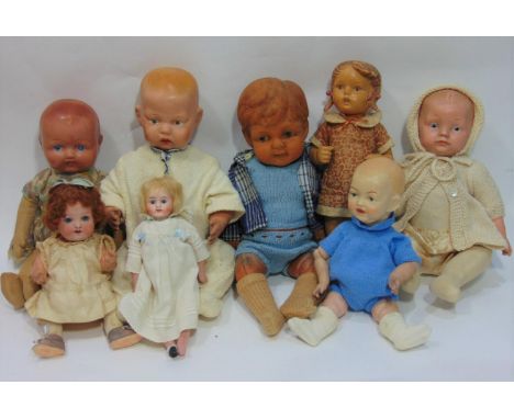 9 small 20th century dolls including 1960's Goebel/ Hummel puppee girl, probably rubber, height 28cm, a small bisque shoulder