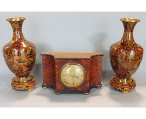 Early 20th century serpentine yewwood mantle clock with ebonised borders and gilt ball feet, with textured gilt dial and Roma