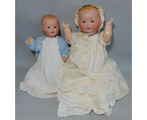 2 bisque head baby dolls Dream Babies both with composition bent limbs; the first has brown fixed eyes, open mouth with teeth