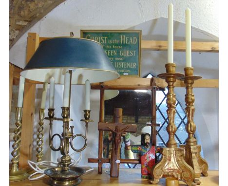A good mixed lot comprising a three branch brass table lamp with toleware type shade, a pair of brass open barley twist candl