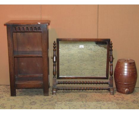 A reproduction oak toilet mirror of rectangular form with ring turned rails together with a small salt glazed stoneware spiri