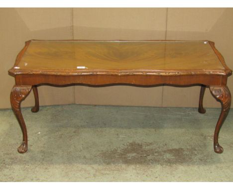 A reproduction walnut veneered side table fitted with a serpentine moulded frieze drawer raised on slender cabriole supports 