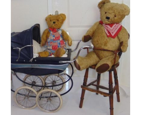 2 large vintage teddy bears with a wooden high chair and Silver Cross dolls pram; bears have golden fur, stitched mouth and n