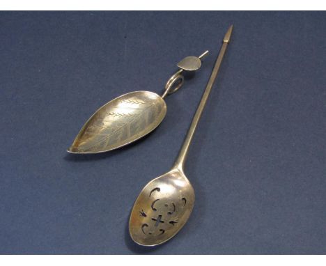 An unusual early English silver sifter teaspoon with pointed shank and pierced bowl, together with a further white metal cadd