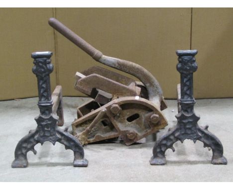 A pair of Antique gothic heavy cast iron fire dogs initialled S and F 38cm high together with a vintage cast iron pipe bender
