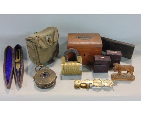 A mixed lot comprising an unusual old brass padlock with four letter combination, a leather cased measuring tools, Sampson Mo