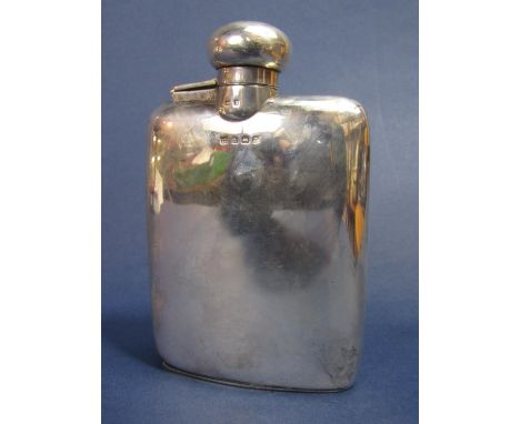 Good quality silver hip flask of shaped form, screw top with cork lining, maker marks indistinct, Birmingham 1922, 12 cm long