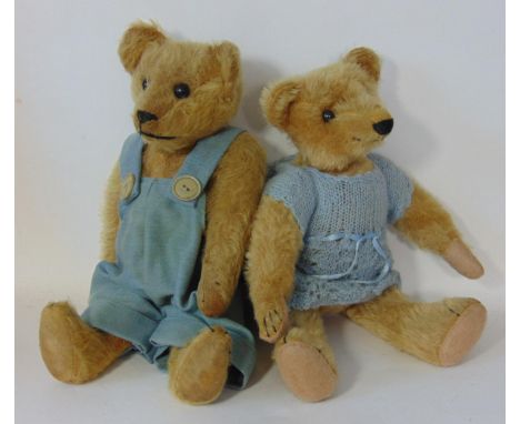 2 small 1930's teddy bears with stitched noses and claws, boot button eyes, long limbs, humped back and stuffed with wood woo