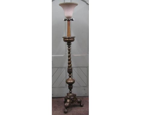 A brass lamp standard in the form of a 17th century brass pricket candlestand, the spiral twist and tapering column support w