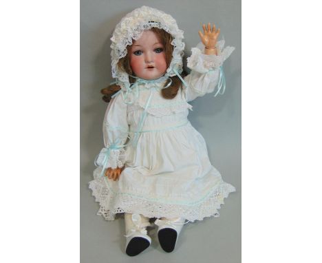 A CM Bergmann Waltershausen bisque headed doll, having sleeping blue eyes, open mouth with top teeth showing, long brown hair