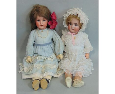 2 German bisque socket head dolls with jointed composition bodies, both with sleeping blue eyes and open mouth with teeth. Ta