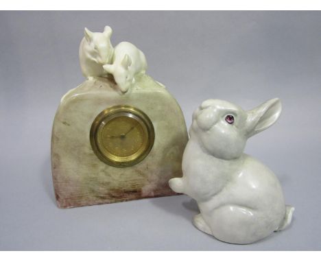 Friedrich Goldscheider (Austrian 1845-1897) - A mantel clock case modelled as a piece of cheese surmounted by a pair of white