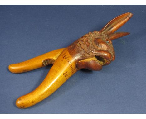A Danish carved softwood nutcracker in the form of a hare's head, ears erect - Himmelbjerget 1923, 25cm 