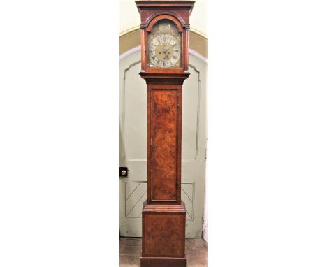 A Georgian walnut London longcase clock, the door of full length with figured veneers, the hood with column supports enclosin