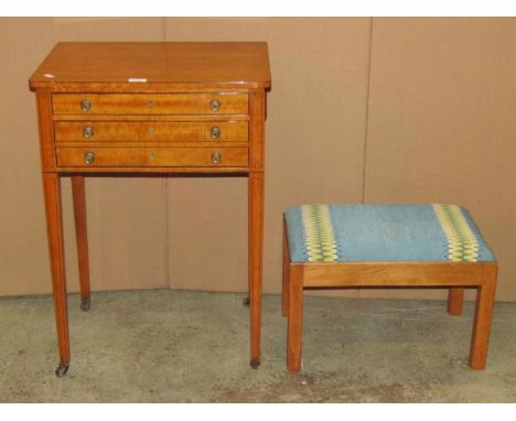 A 19th century satinwood sewing/work table of rectangular form with single drop leaf, candle slides and fitted with two long 