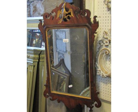 A Chippendale style wall mirror with gilt painted slip, fret carved frame and gilt ho-ho bird detail, 72 cm x 45 cm 
