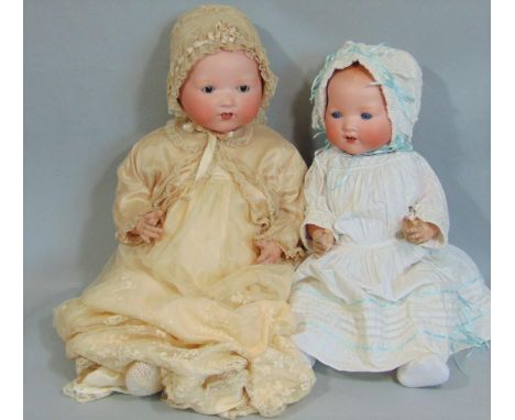 2 Armand Marseille Dream Babies both with bisque socket heads on composition bodies with bent limbs, open mouths with 2 lower