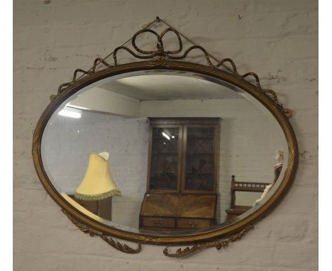 Gilt framed oval mirror