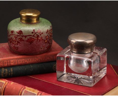 An early 20th century cameo glass inkwell, decorated with trailing branches on a frosted ground, hinged cover, 10cm diameter;