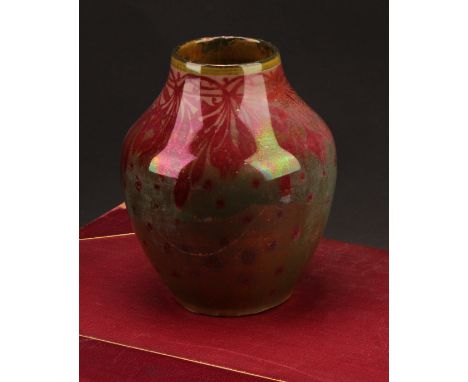 A Pilkington's Royal Lancastrian lustre ovoid vase, decorated in tones of red on a copper-green ground, 13cm high, painted mo