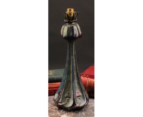 A Delphin Massier Vallauris Art Nouveau table lamp, moulded and decorated with stylised flowers, and glazed in tones of irrid