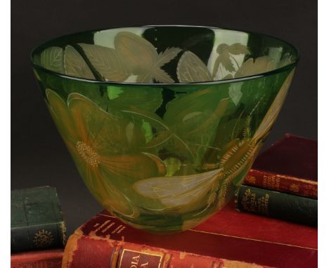 A Scottish art glass bowl, by Julia Lingstead, engraved with flowers, a bee, and a butterfly on a green ground, 19cm high