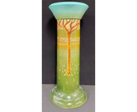 An art pottery jardinière stand, tube lined with trees in a landscape, 73cm high, c. 1880