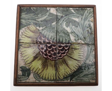 WILLIAM DE MORGAN SECTIONAL TILE. Of Persian influence and painted with a yellow flower head, the tile in four separate secti