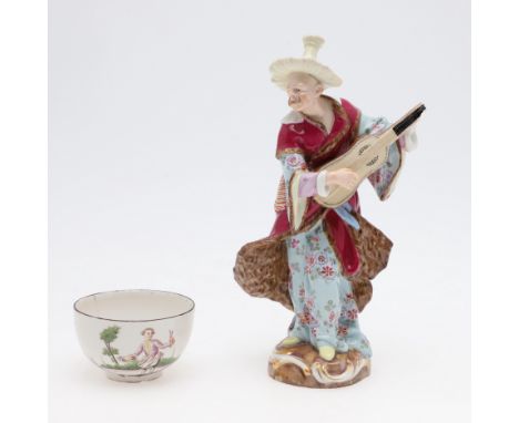 MEISSEN PORCELAIN FIGURE OF A MUSICIAN &amp; PORCELAIN TEA BOWL. A 19thc figure of a Male Malabar Musician, with Meissen cros