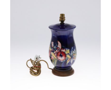 LARGE MOORCROFT LAMP &amp; SHADE - SPRING FLOWERS. A large lamp painted in the Spring Flowers design on a blue ground, mounte