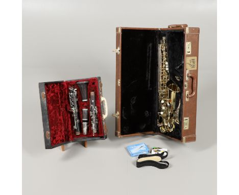 CASED SAXOPHONE - TREVOR JAMES &amp; CO, &amp; ENGLISH CASED CLARINET. A brass 'The Horn' saxophone, Serial Number T05626, wi