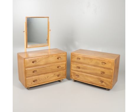 ERCOL ELM AND BEECH DRESSING TABLE AND CHEST OF DRAWERS. An elm dressing table with hinged mirror above three drawers, one wi