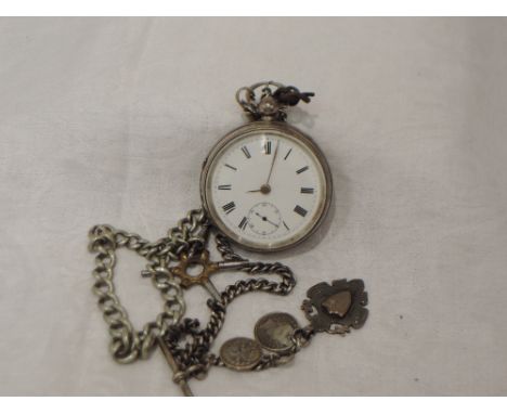 An Edwardian silver key wound pocket watch having Roman numeral dial with subsidiary seconds in a silver case with engine tur