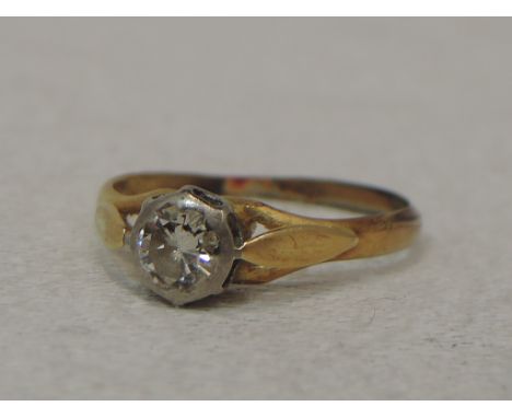 A lady's dress ring having a diamond solitaire, approx 0.45ct in a collared mount to open shoulders on a yellow metal loop st