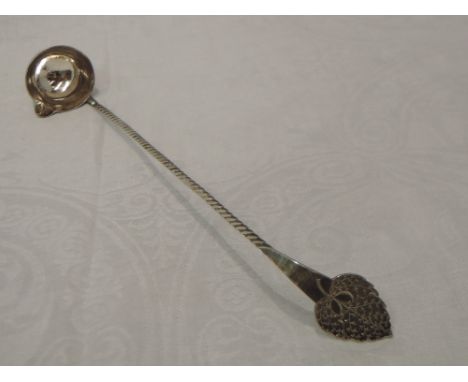 An Early 20th Century Dutch silver toddy ladle having twist stem and engraved leaf style terminal 