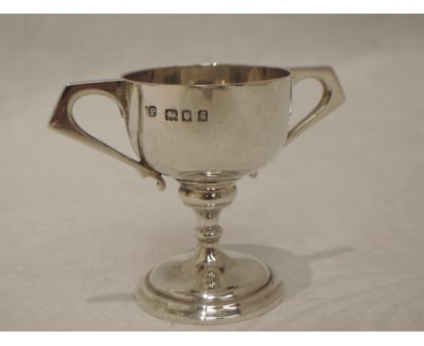 A miniature silver trophy of plain form having architectural handles, London 1922, Robert Pringle &amp; Sons