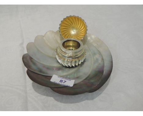 A shaped abalone shell stand having a plated pedestal base and French silver ovoid shaped trinket to top with hinged lid cont