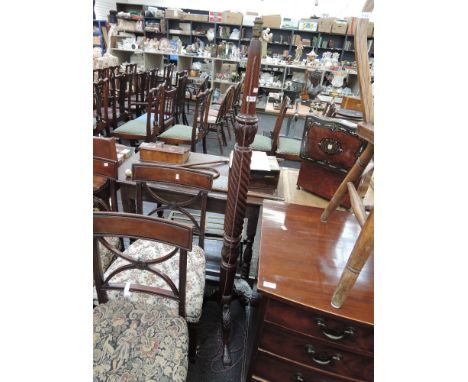 An early 20th century mahogany torchere/standard lamp having wrythen column and carved triple splay legs