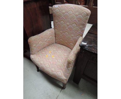 An Edwardian frame armchair having 20th century Sanderson print upholstery and tapered legs