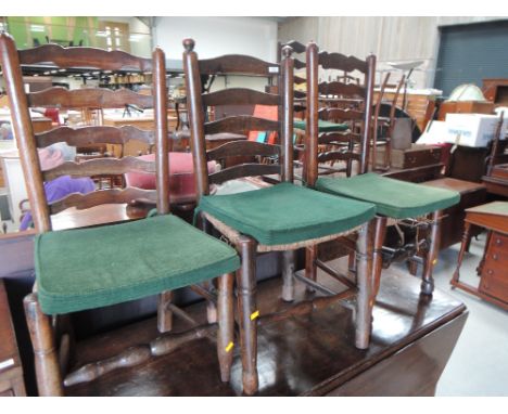 Three early 19th century elm  vernacular matched dining chairs having ladder backs with rush seats and turned legs and a simi