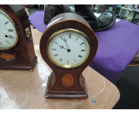 An Edwardian mahogany mantel clock of balloon design having inlay decoration