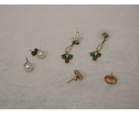 A pair of 9ct gold stud earrings having green cabouchon stones with drop loops to a further trio of stones, a pair of culture