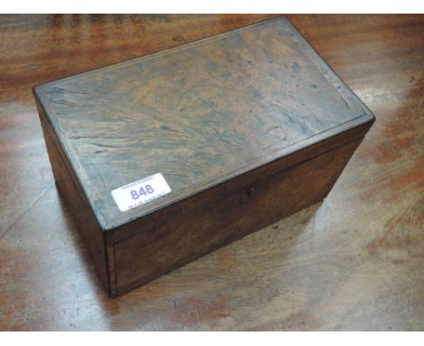 A 19th century burr walnut tea caddy having typical two division interior