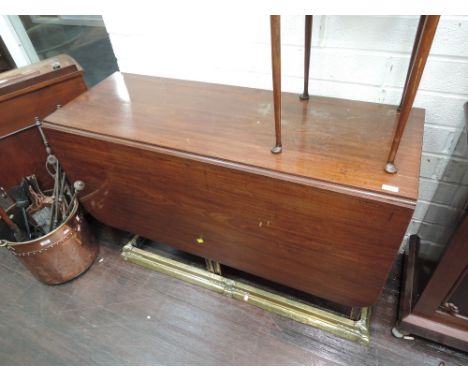 A 19th century mahogany dining table having drop leaf top on double gate legs