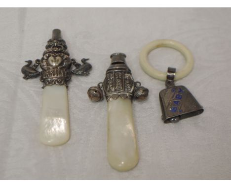 A baby's silver rattle having moulded Darling decoration,two duck charms, whistle and mother of pearl teething handle, Birmin