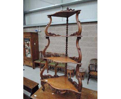A Victorian mahogany corner whatnot/etage having bobbin and scroll frame